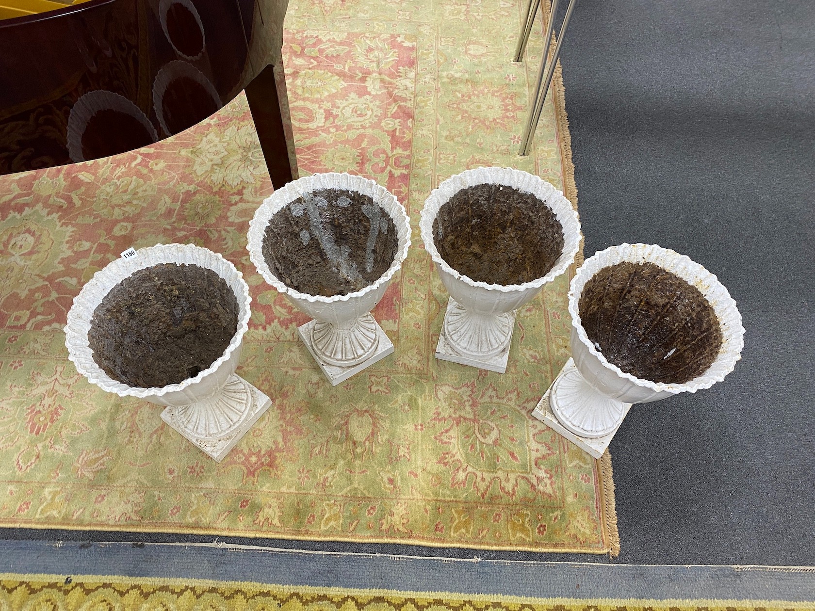 A set of four Victorian painted cast iron garden urns, diameter 38cm, height 53cm